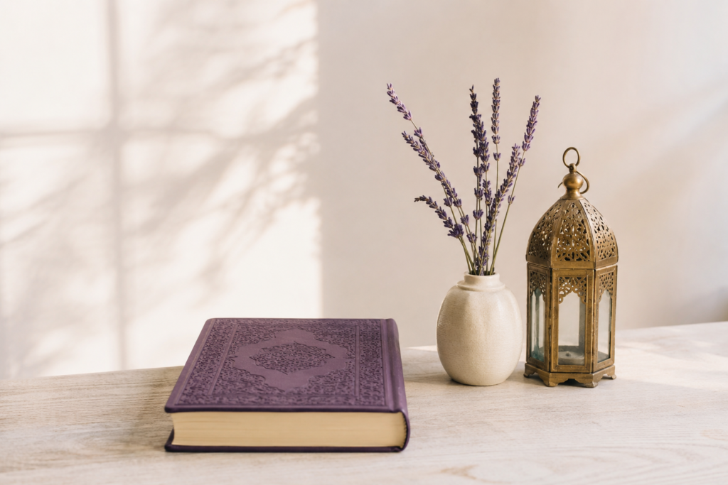 Minimalist Quran study setup with a closed Quran, lavender flowers and Islamic lantern